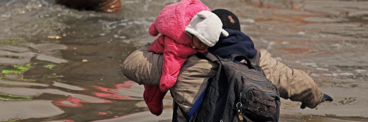 Migrants attempt to cross the Rio Grande