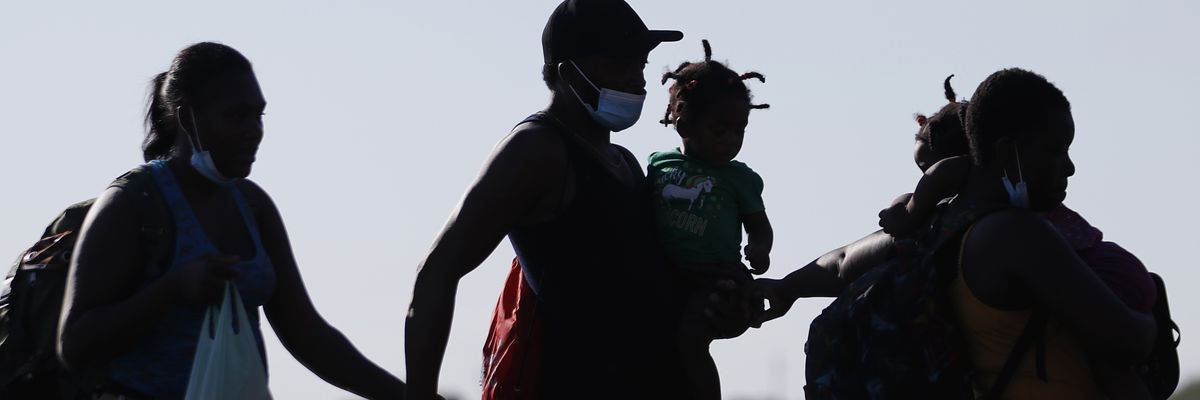 Migrants cross Rio Grande into Del Rio, Texas