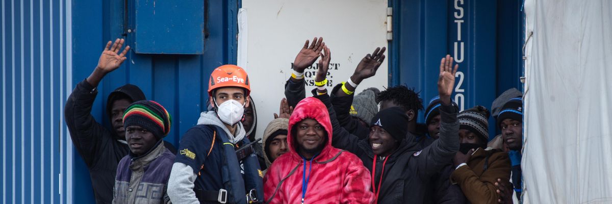 Migrants disembark from the Sea Eye 4 ship in Naples, Italy following a rescue in the Mediterranean Sea on February 6, 2023.