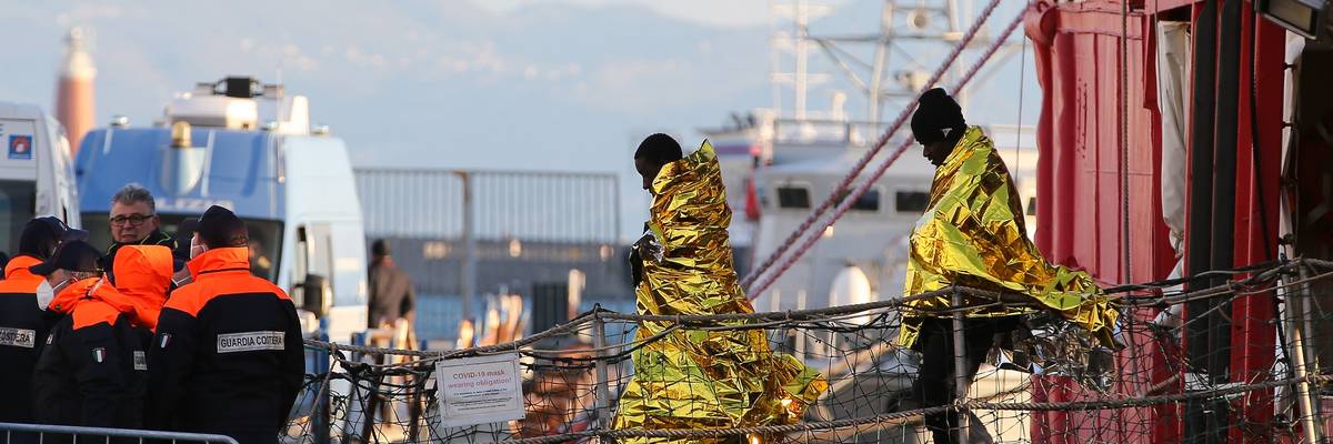 Migrants disembark in Naples, Italy