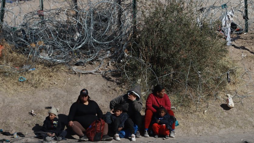 Migrants try to reach the United States border