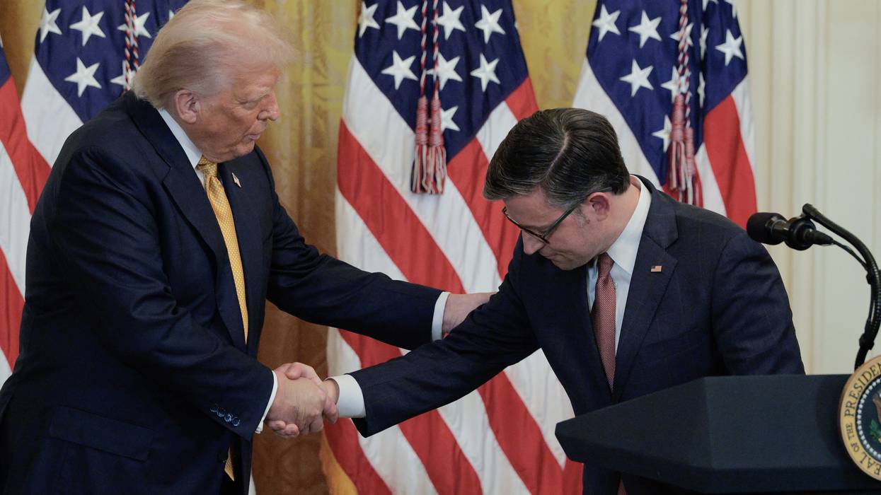 Mike Johnson grovels before Donald Trump, bowing his head while shaking the president's hand