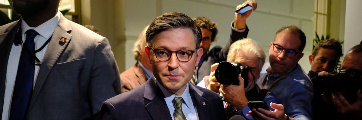 Mike Johnson speaks to reporters.