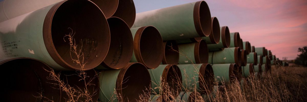 Miles of unused pipe, prepared for the proposed Keystone XL pipeline, sit in a lot on October 14, 2014 outside Gascoyne, North Dakota. (Photo: Andrew Burton via Getty Images)