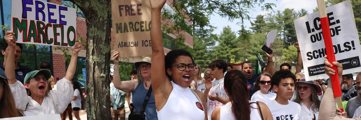 Milford High School students who had gathered to demand Marcelo Gomes da Silva's release from ICE detention react as they learn that he had been ordered released on bail