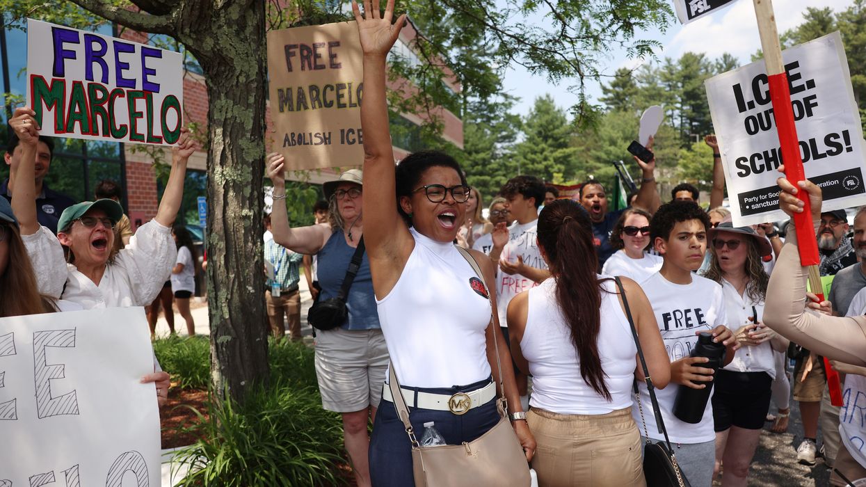 Milford High School students who had gathered to demand Marcelo Gomes da Silva's release from ICE detention react as they learn that he had been ordered released on bail