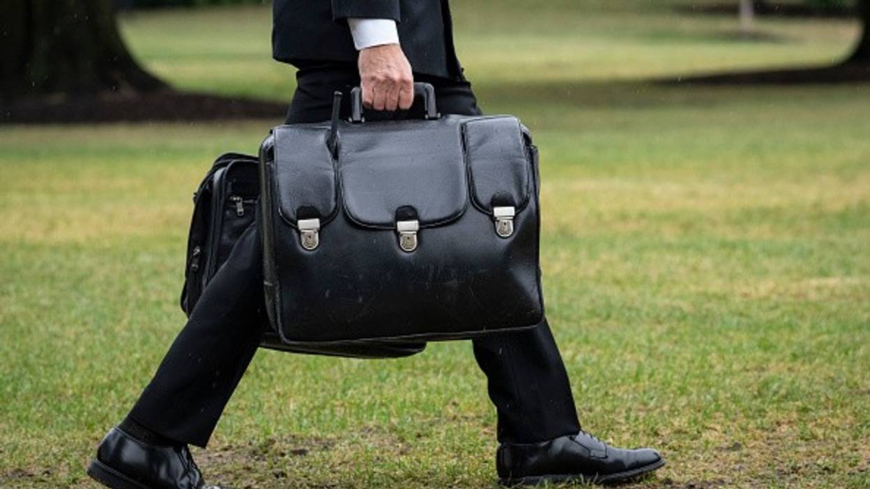 Military aide carries nuclear football.