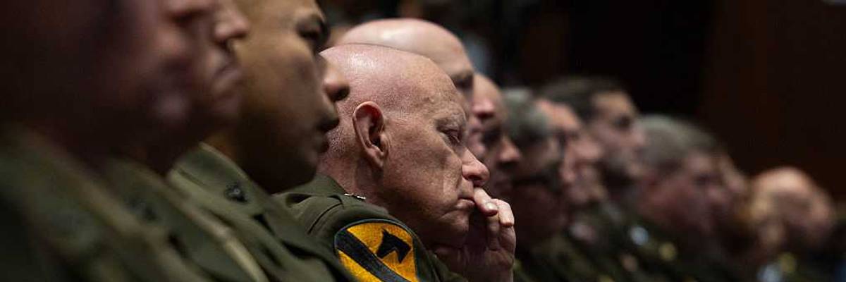 Military leaders listen to Trump.