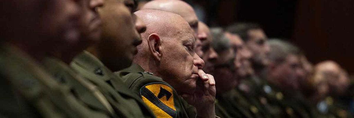 Military leaders listen to Trump