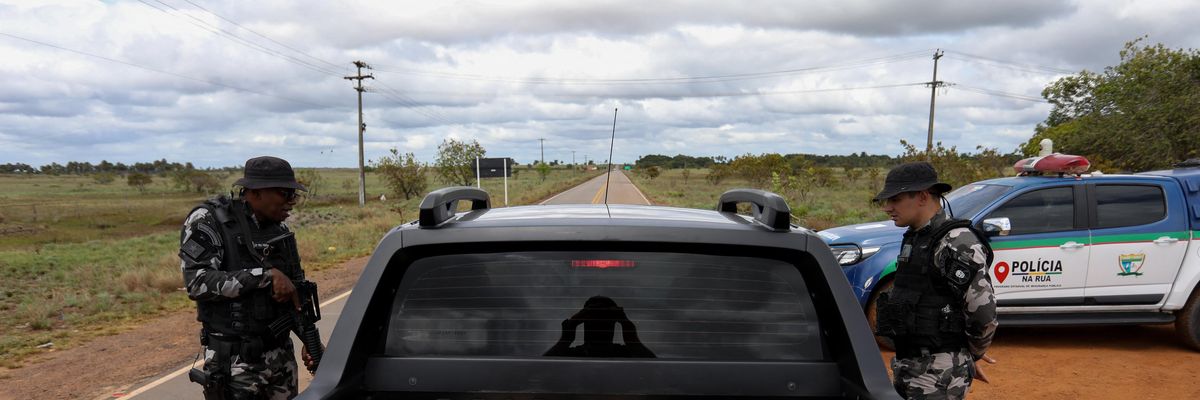 Military police check vehicles in an effort to arrest illegal miners