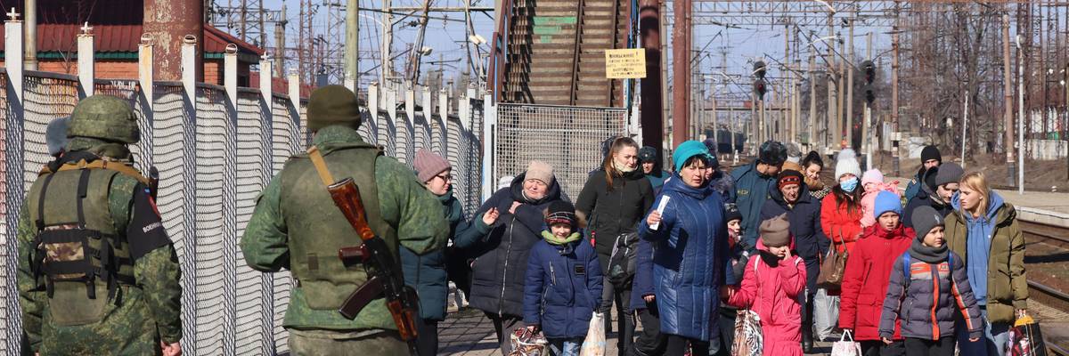 Military police officers guard a railway station while citizens of the Donetsk People's Republic (DPR) are being evacuated to Russia. Amid the escalating conflict in east Ukraine, on February 18, 2022, the heads of the Lugansk and Donetsk People's Republics announced a mass evacuation of civilians to Russia.