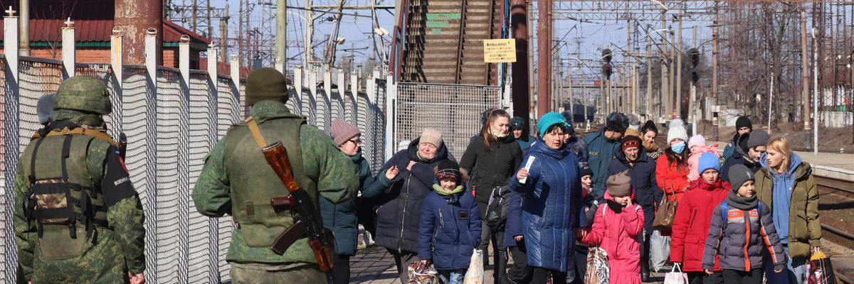 Military police officers guard a railway station while citizens of the Donetsk People's Republic (DPR) are being evacuated to Russia. Amid the escalating conflict in east Ukraine, on February 18, 2022, the heads of the Lugansk and Donetsk People's Republics announced a mass evacuation of civilians to Russia.