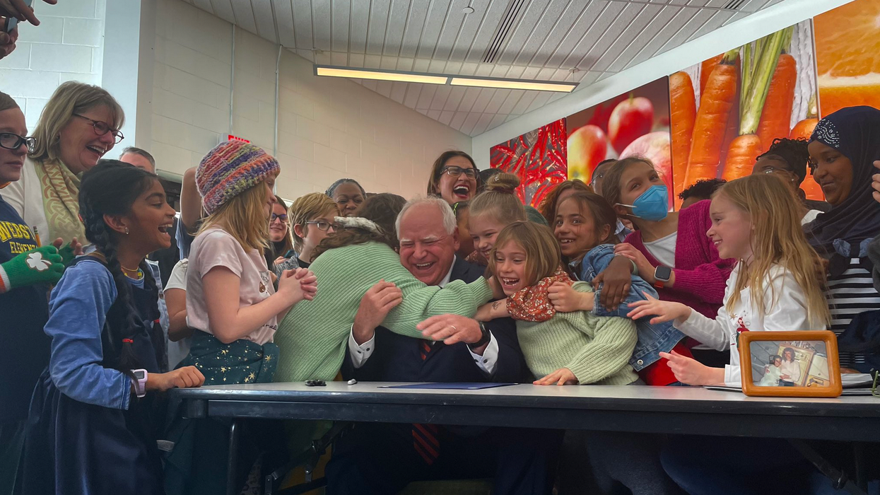 Minnesota Gov. Tim Walz hugs students