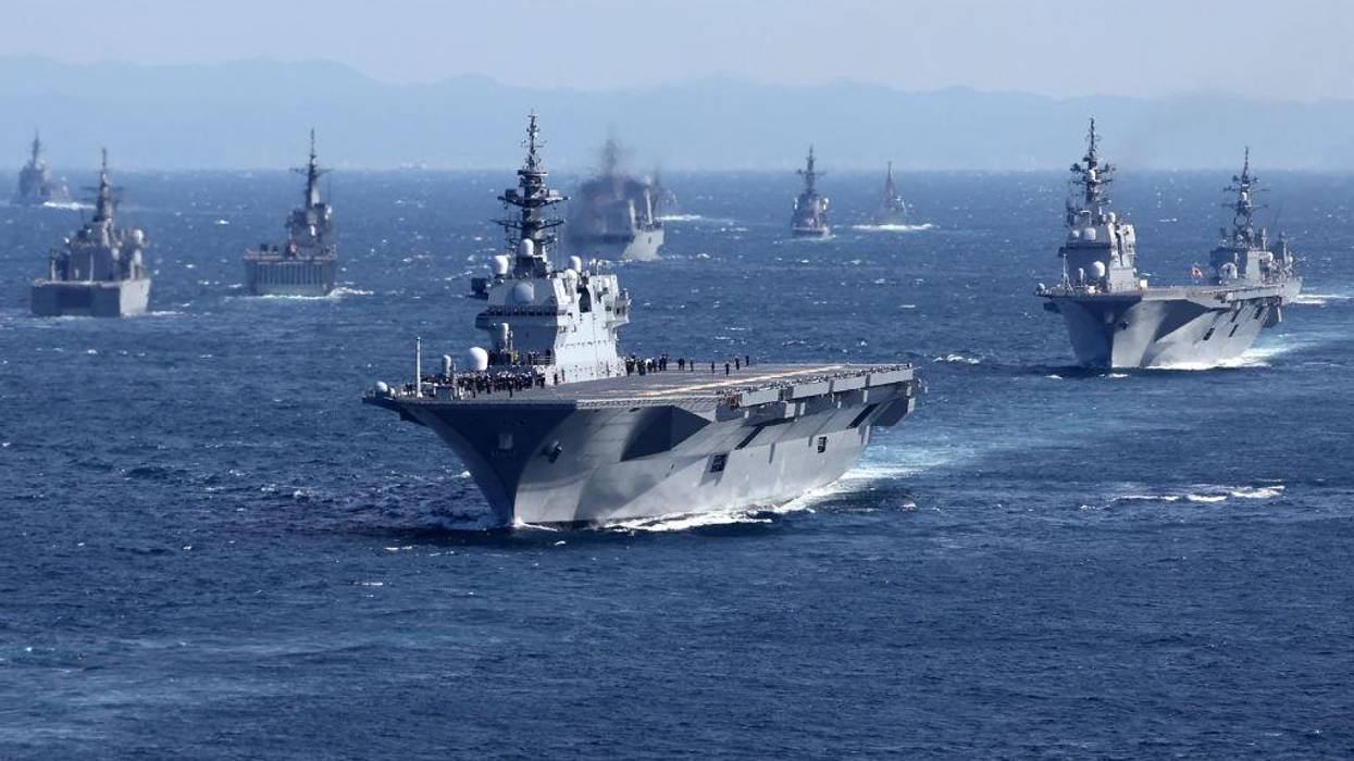 Mlitary vessels, including Japan's Maritime Self-Defense Force's largest escort ship "Izumo," at sea