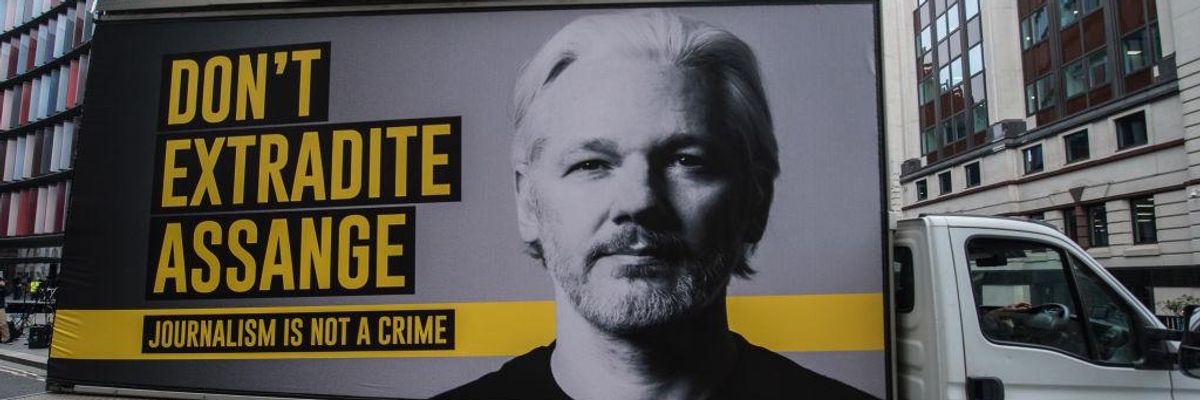 Mobile billboard says "Don't Extradite Assange: Journalism is not a crime"
