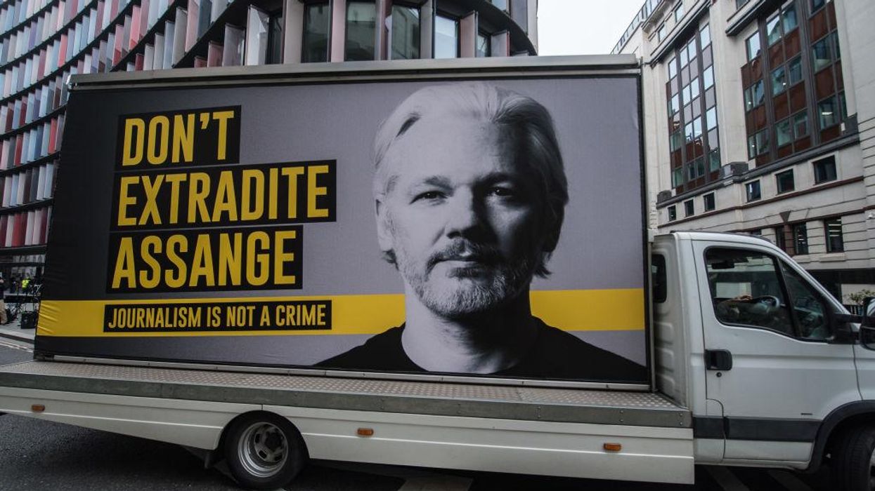 Mobile billboard says "Don't Extradite Assange: Journalism is not a crime"