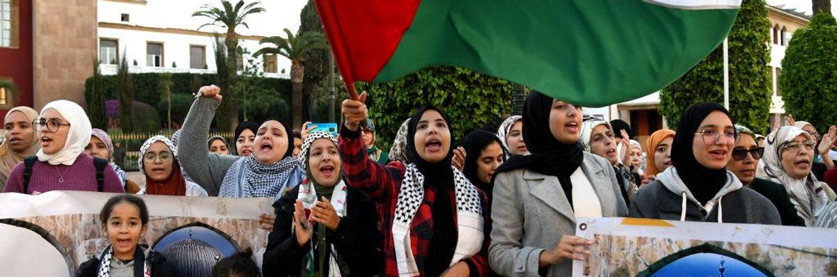 Moroccans protest outside Morocco's Parliament in the capital Rabat, against the kingdom's normalization of ties with Israel