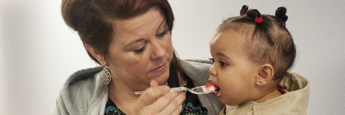 Mother feeding her child