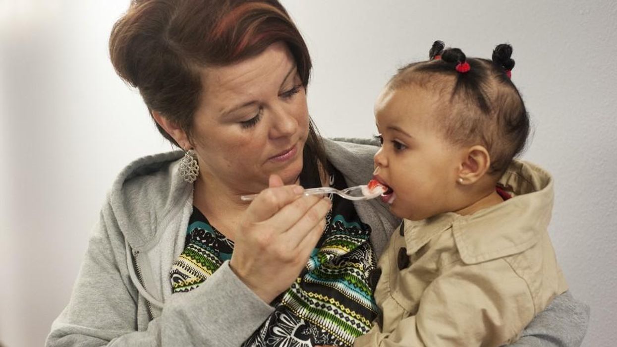 Mother feeding her child