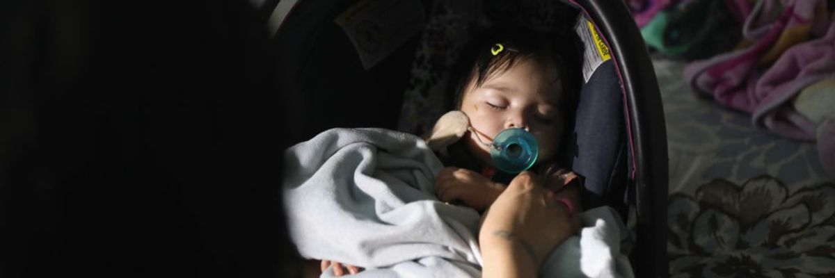 Mother tends to children