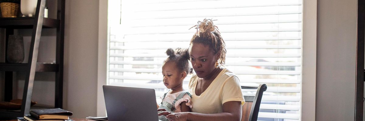 mother works from home with child