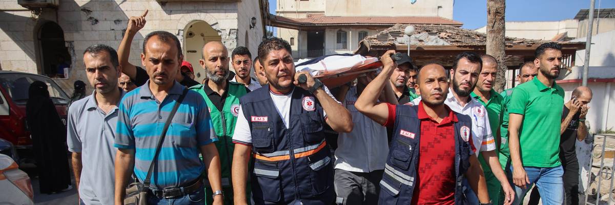Mourners carry the body of Palestinian doctor Hani al-Jaafarawi