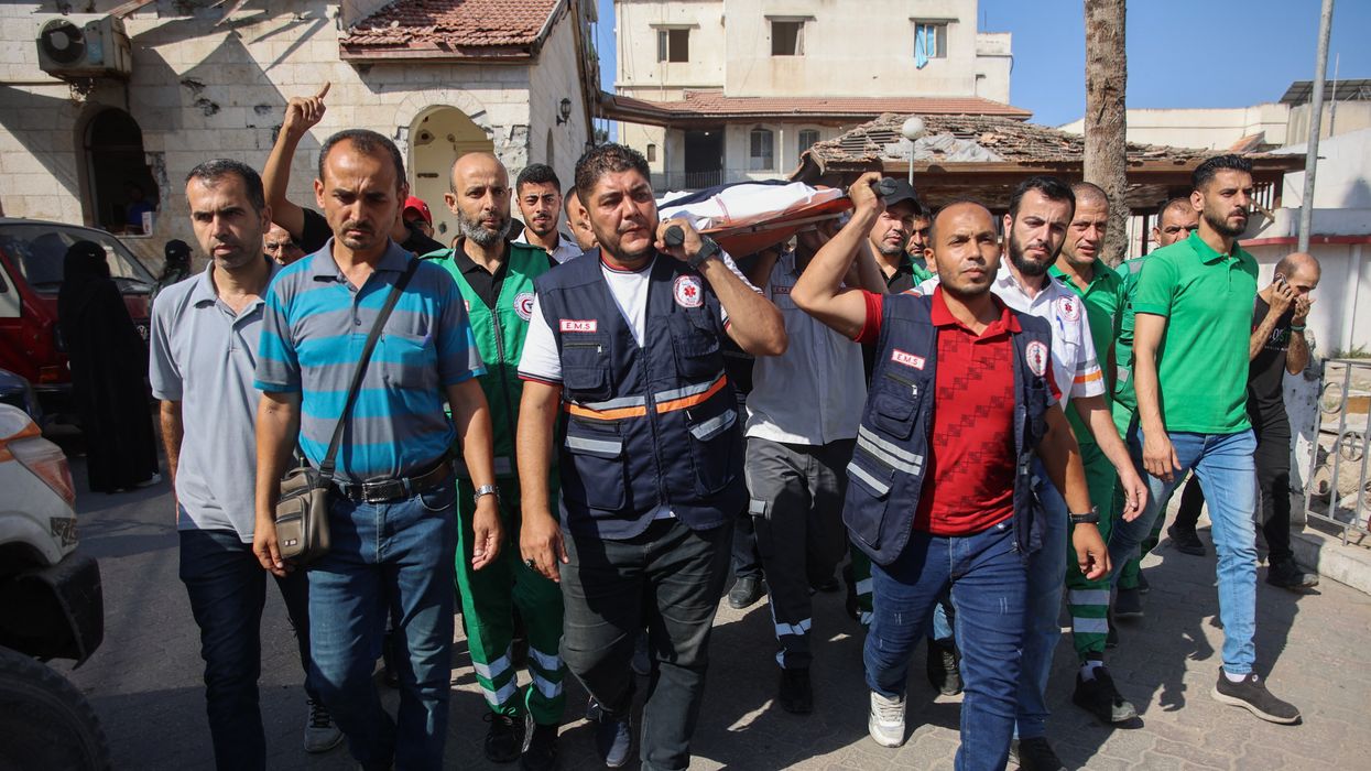 Mourners carry the body of Palestinian doctor Hani al-Jaafarawi