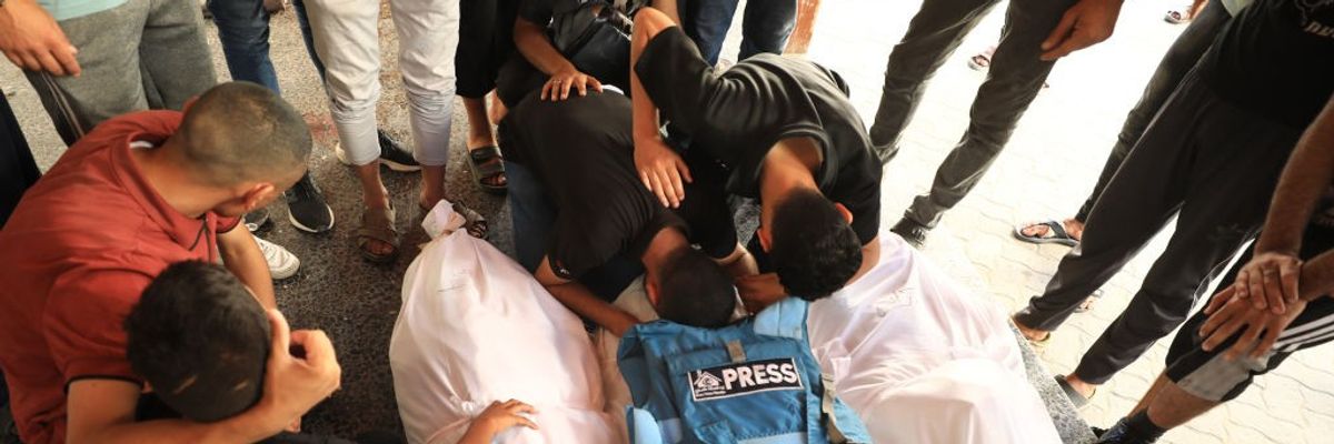 mourners gather in gaza city