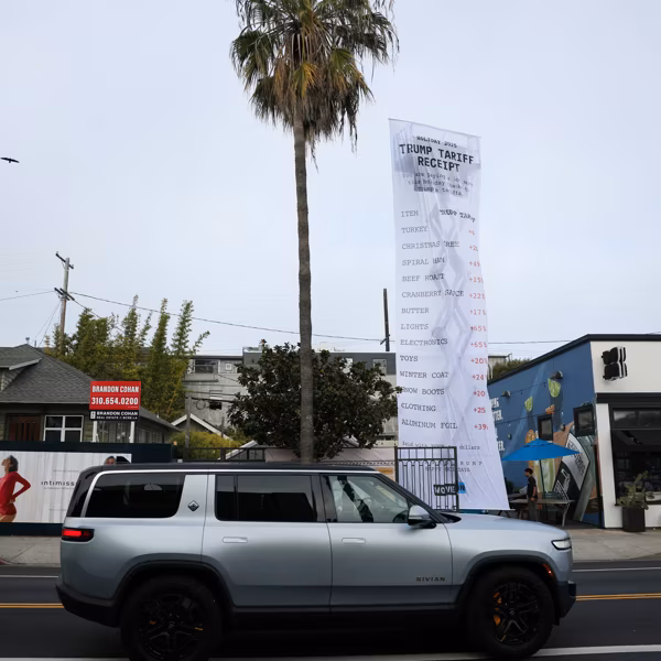 MoveOn protests against President Donald Trump's tariffs with a 40-foot-long banner resembling a receipt