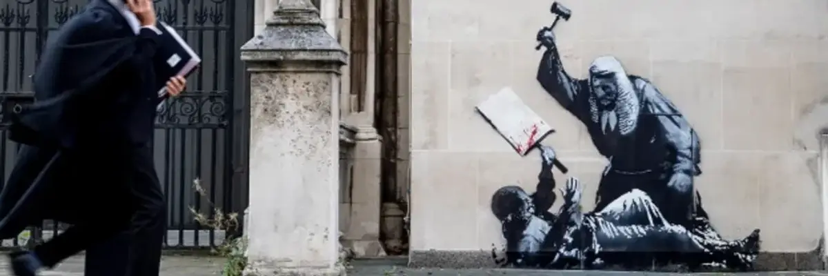 Mural by Banksy depicting a judge beating a protester with a mallet