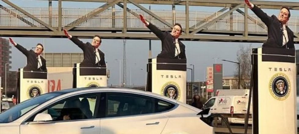 Musk cut-outs of Tesla charging stations at U.K protest