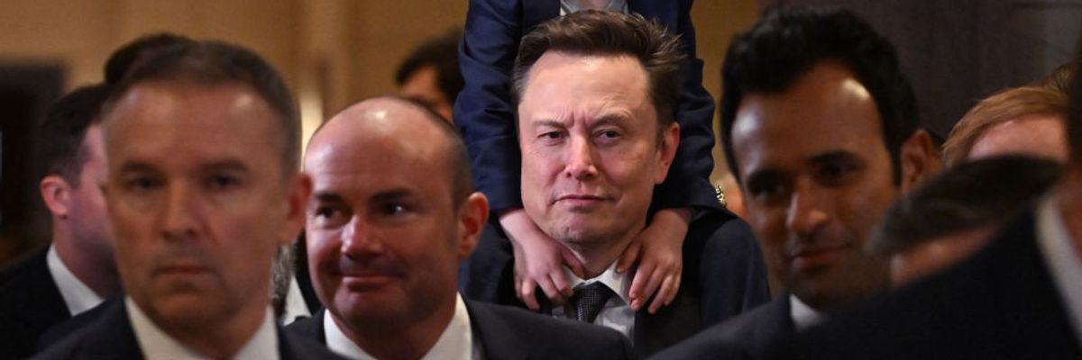 Musk with son on shoulders and Vivek Ramaswamy in foreground
