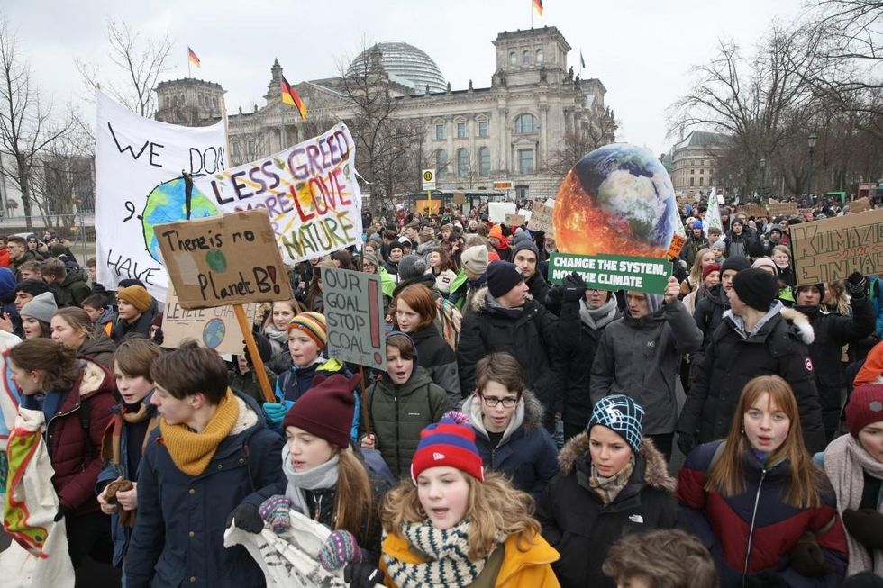 n front of the Ministry for the Economy, calling for an immediate end to coal produStriking high school students march in front of the Reichstag building, seat of the German Parliament the Bundestag, during a protest for more effective government climate change policy on January 25, 2019 in Berlin, Germany. (Photo by Omer Messinger/Getty Images)
