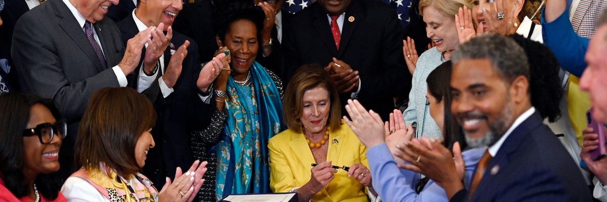 Nancy Pelosi signs Inflation Reduction Act