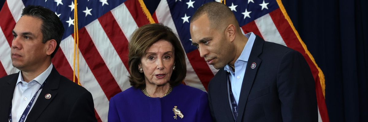 Nancy Pelosi speaking with Jakeem Jeffries
