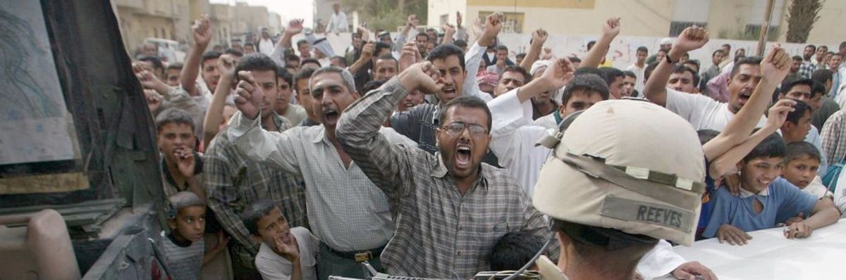 Nasariyah residents protest 15 April, 2003 the presence of US troops in Iraq.