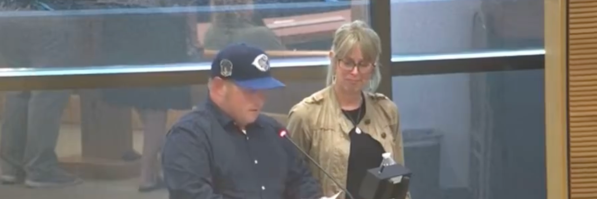 Nathan Clark, accompanied by his wife Danielle, spoke at a Springfield City Commission meeting in Springfield, Ohio