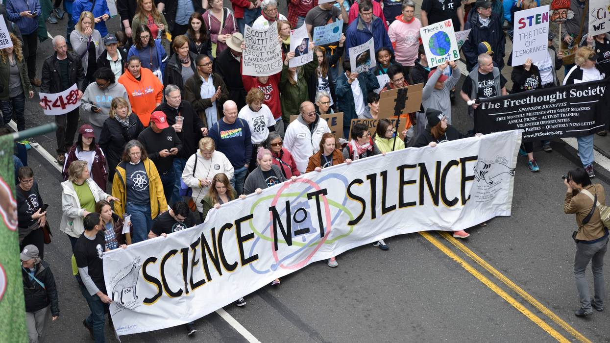 National March for Science in Philadelphia featuring "Science not Silence" banner.