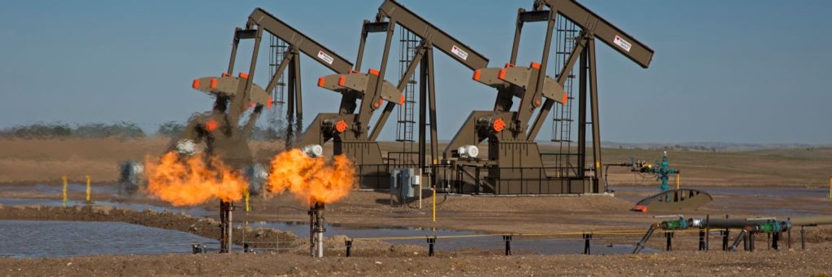 Natural gas is flared off as oil is pumped in Watford City