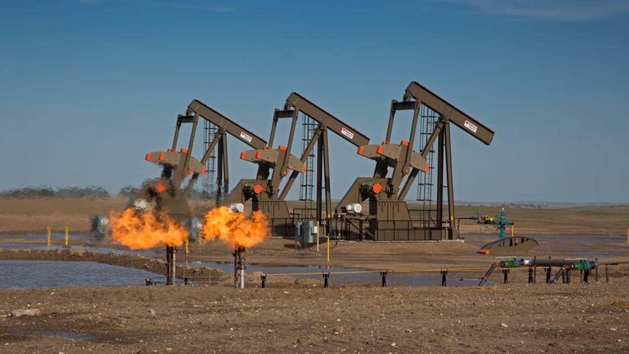 Natural gas is flared off as oil is pumped in Watford City