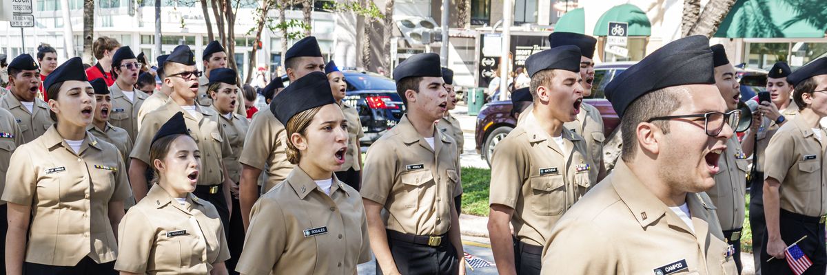 Naval JROTC cadets take part in a Veterans Day parade