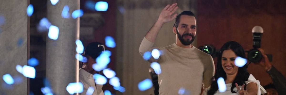 Nayib Bukele and his wife Gabriela Rodriguez greet supporters celebrating his reelection