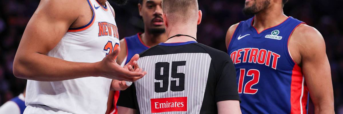 NBA referee in Emirates shit talks to a Knicks and a Pistons player.