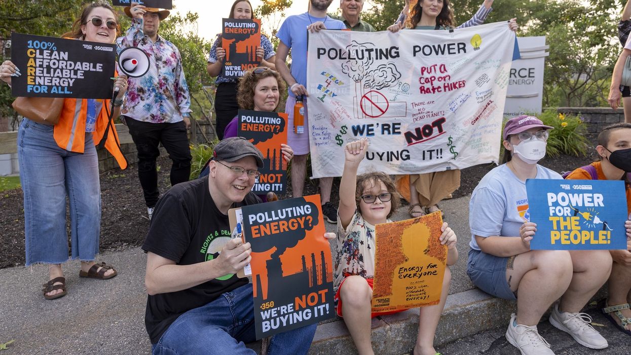 New Hampshire residents protest rate hikes and call for clean energy.