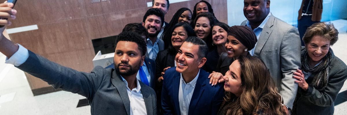 New members of the Congressional Progressive Caucus attend an event