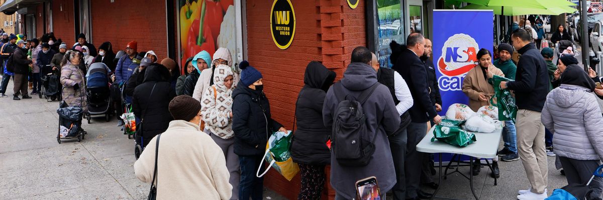 New Yorkers line up around the block for a Thanksgiving turkey giveaway.