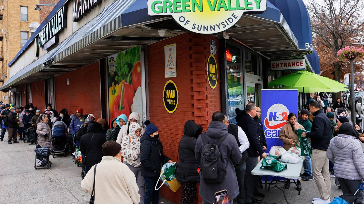 New Yorkers line up around the block for a Thanksgiving turkey giveaway.