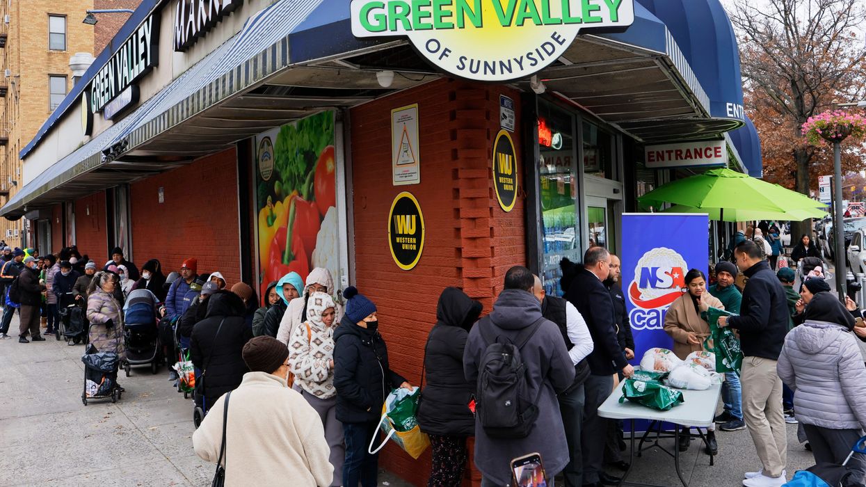 New Yorkers line up around the block for a Thanksgiving turkey giveaway.