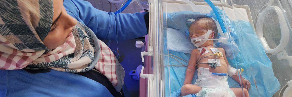 Newborn baby in incubator