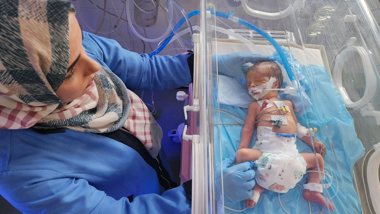 Newborn baby in incubator